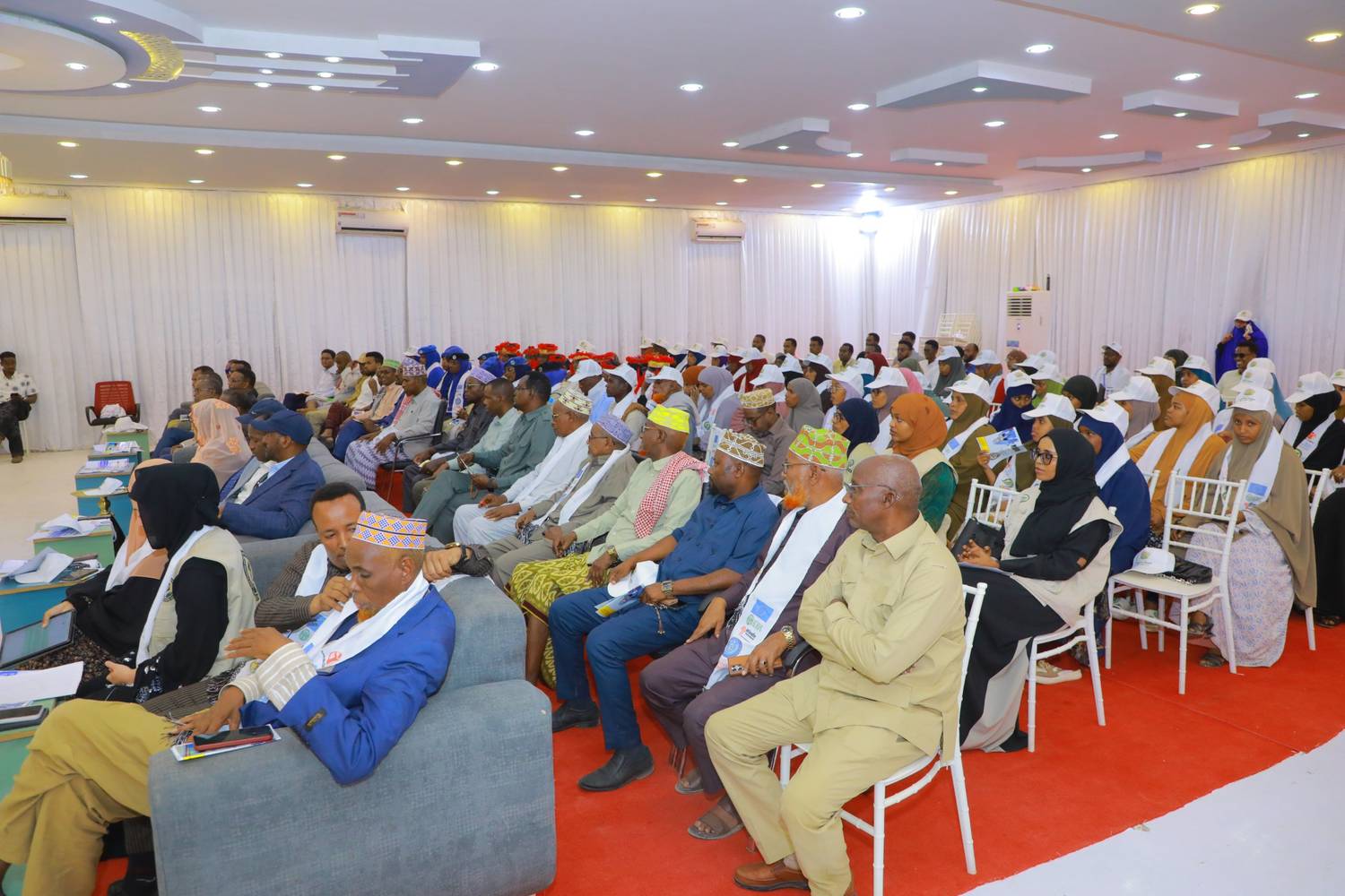 Community gathering with elders, women leaders and police