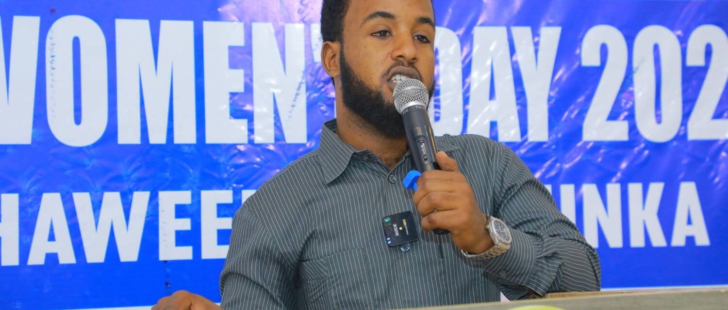 A speaker addressing a Women’s Day event